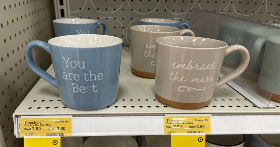 mugs on shelf in store