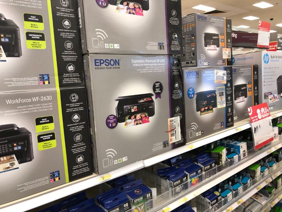 printer boxes on shelves in store