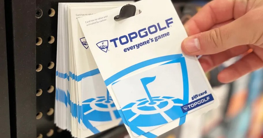 hand reaching for top golf gift card