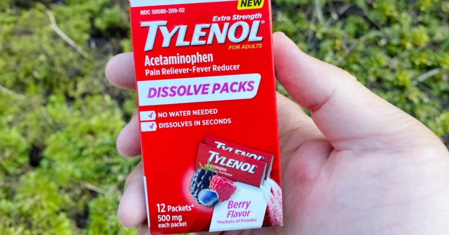 hand holding tylenol dissolve packs box 