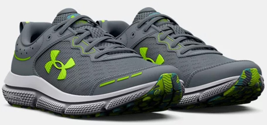 gray and lime green under armour shoes