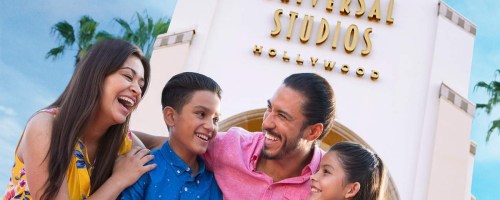 family standing in front of universal studios hollywood sign