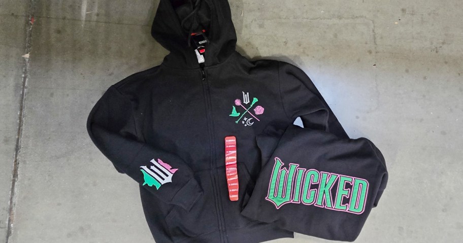 wicked hoodie front and back laying on ground