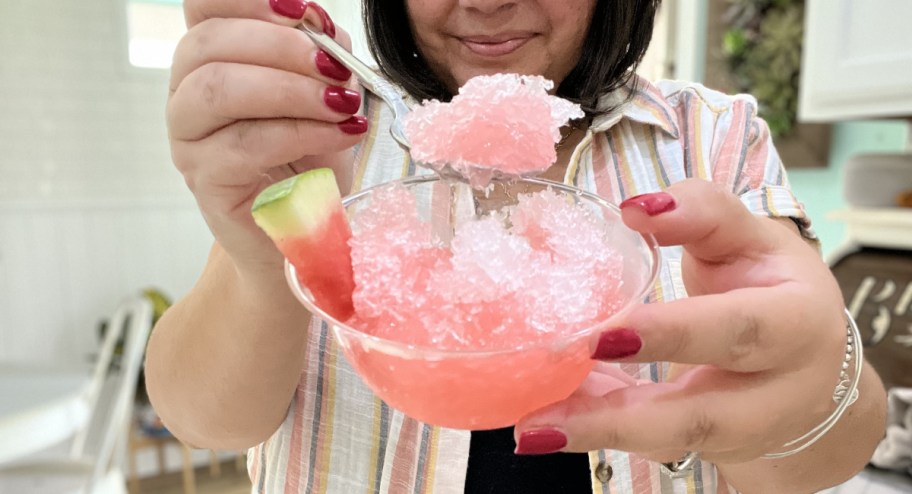 woman holding bowl of shaved ice showing the camera