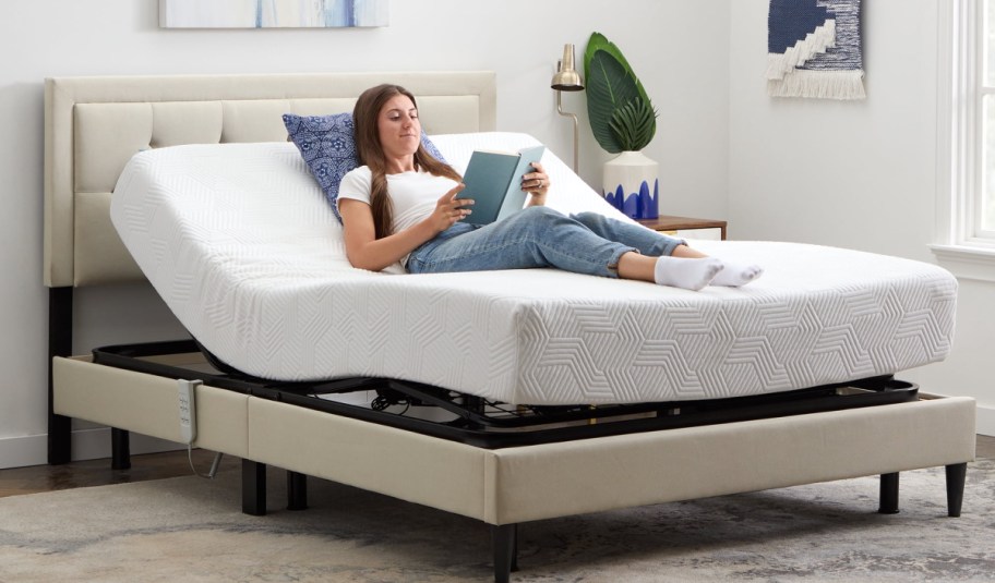 woman laying down on movable base bed