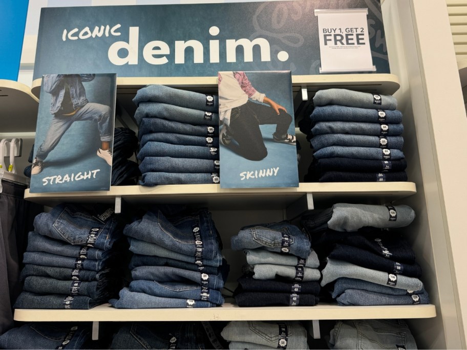 kid's jeans display at Carter's with "denim" signage and "Buy 1, Get 2 Free" signage