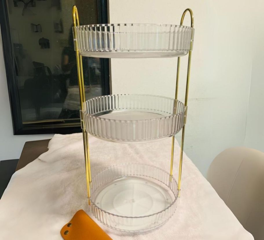 an empty 3 tier rotating makeup organized on a tabletop