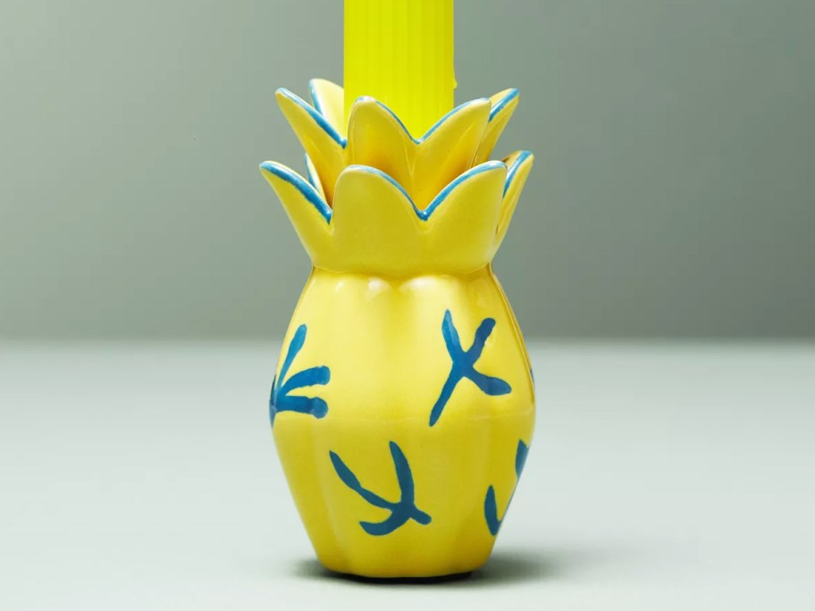 yellow pineapple candle holder with yellow candle