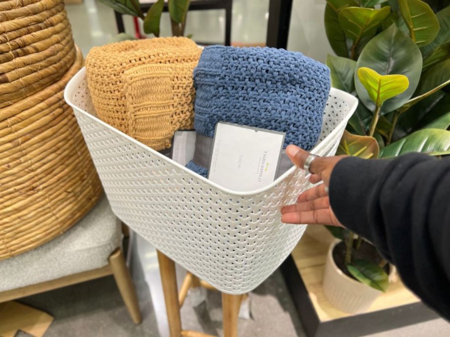 Brightroom Y-Weave XL Curved Decorative Storage Basket with blankets in it in store