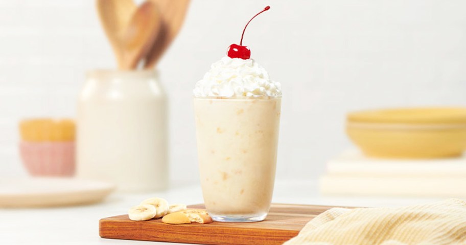 Banana Pudding Milkshake topped with whipped cream and cherry