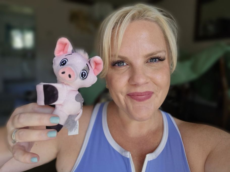 A woman holding Disney Cutie Cuff Pua