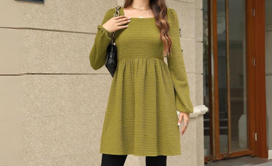 a woman in an avocado green mini swing dress