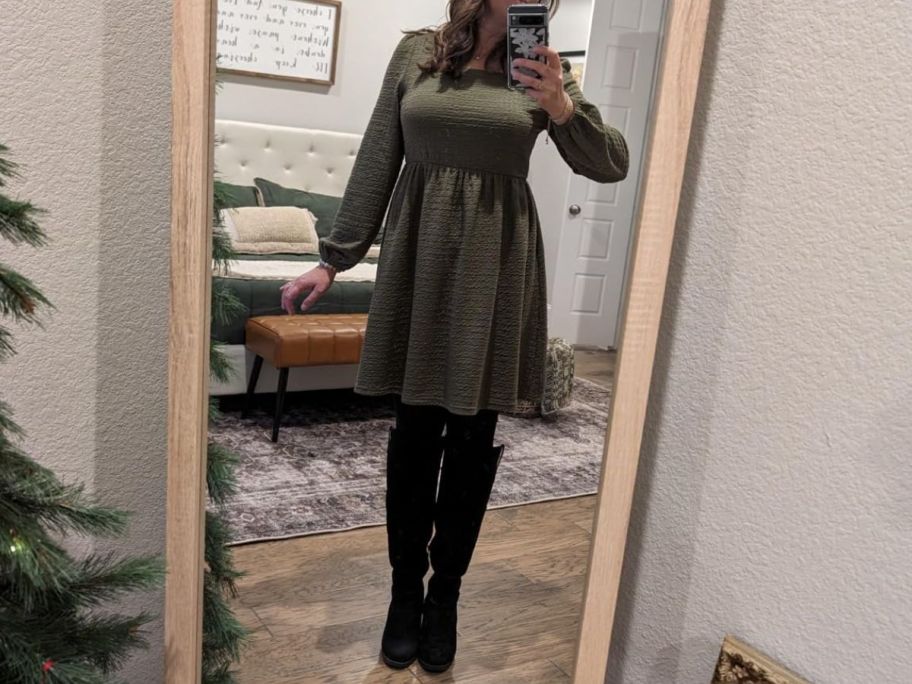 a woman taking a selfie in an olive green mini swing dress