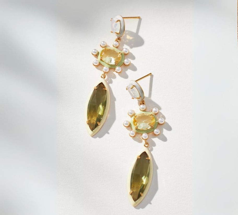 a pair of green gemstone dangle earrings