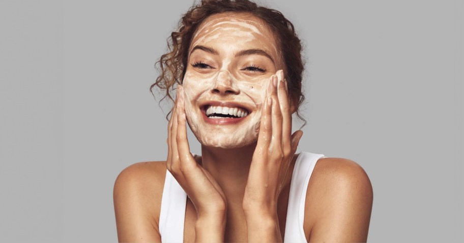 Woman using Glytone Glycolic Acid Face Wash 