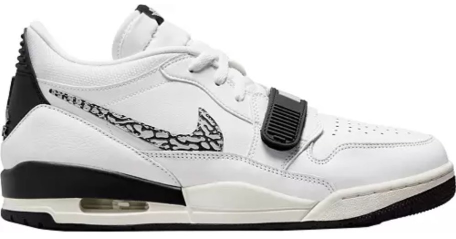 white and black Nike Air Jordan low shoes