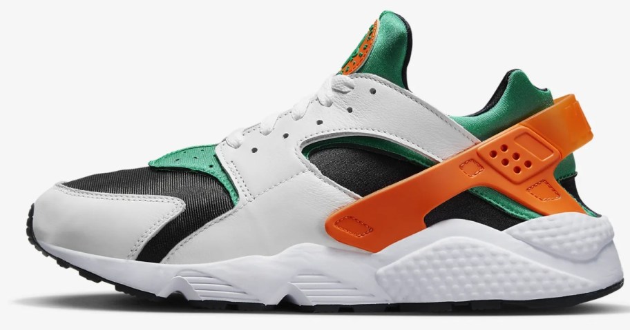 Men's Nike Air shoe in white with black, green, and orange accents