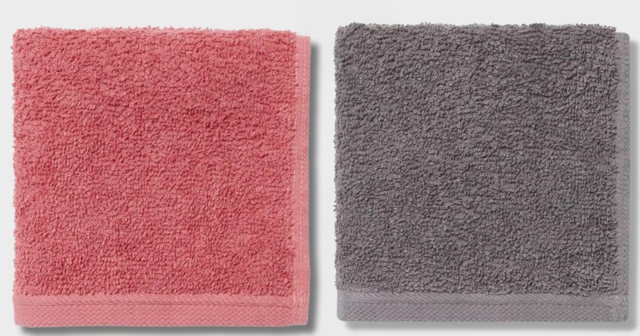 a single pink and a single grey washcloth folded