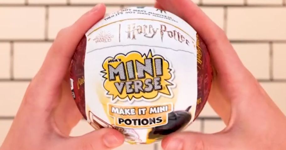 Hand holding a Harry Potter Miniverse Potion Ball