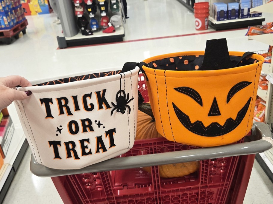 white and orange fabric trick or treat buckets in target cart