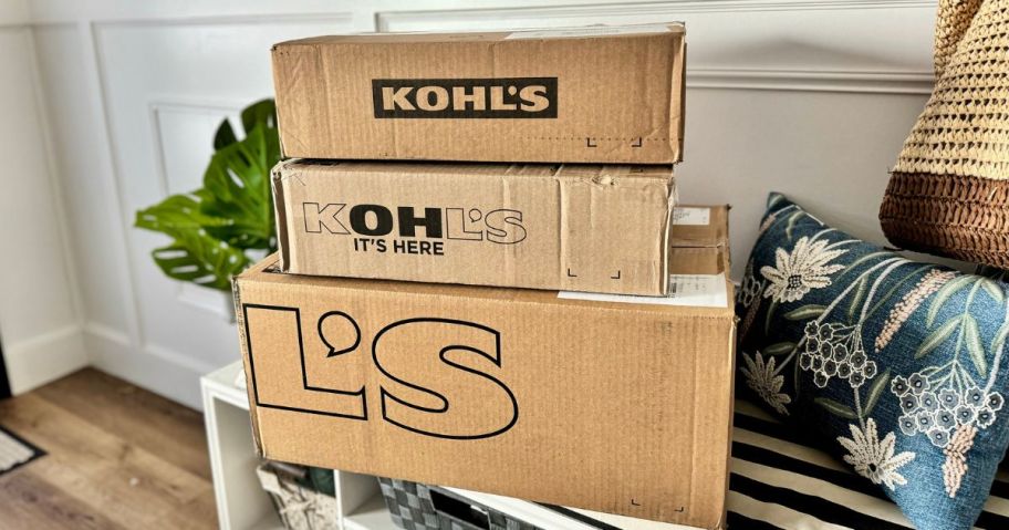 Kohl's Boxes stacked on a bench in an entryway