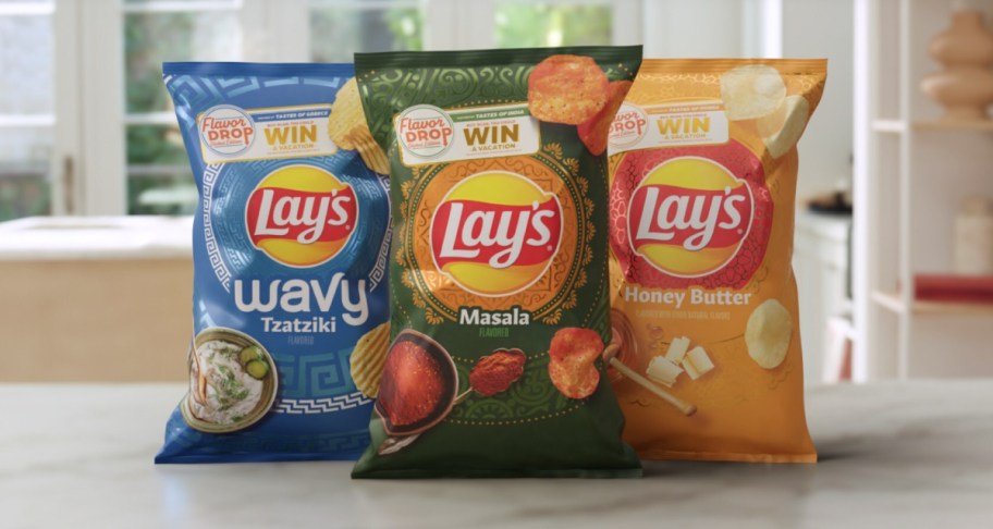 Three packages of Lays chips from the Lays Global Flavors Trio Collection