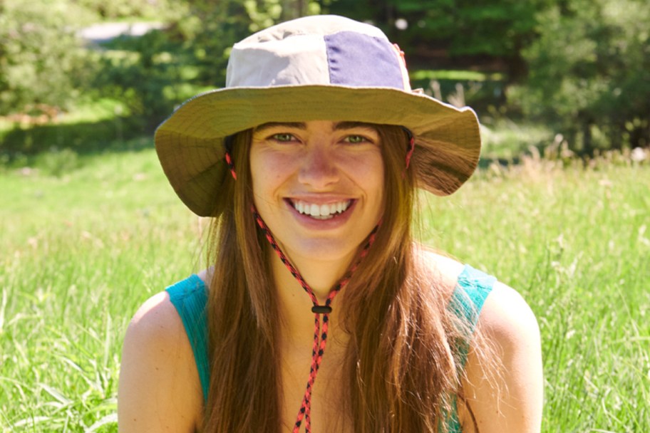 woman wearing bucket hat outside