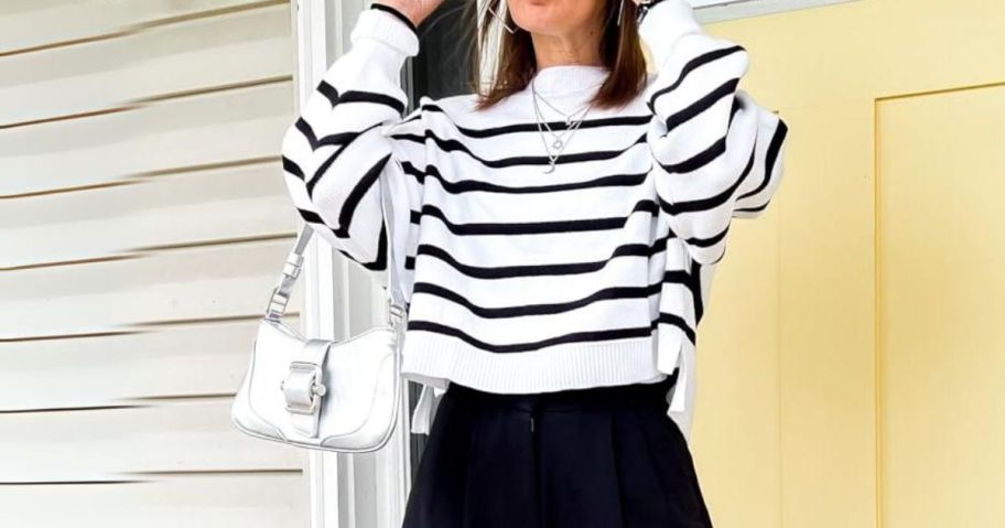 woman wearing Merokeety Women's Long Sleeve Striped Crop Sweater on porch