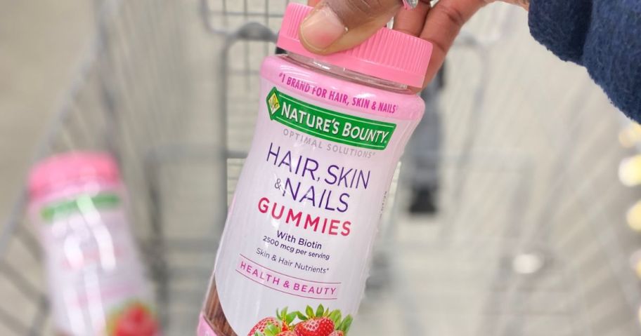 hand holding Nature's Bounty Hair, Skin & Nails Gummies