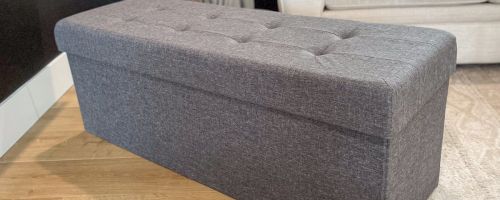 An Ornqavo Tufted Linen Storage Ottoman