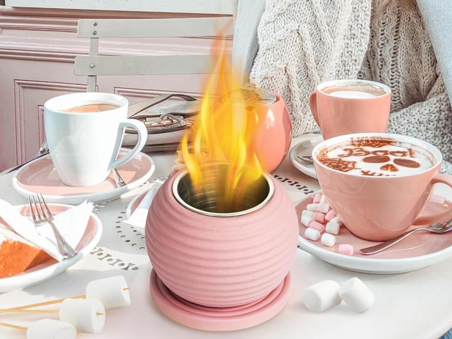 Pink Round small firepit displayed on top of a table