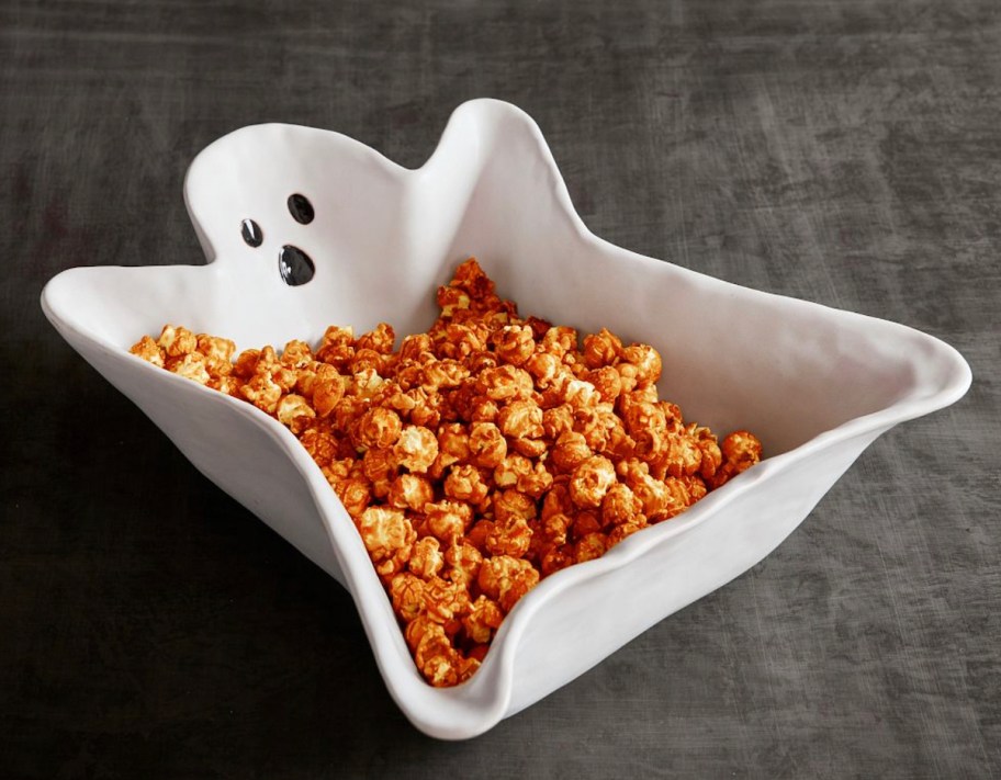 ghost shaped bowl with popcorn inside