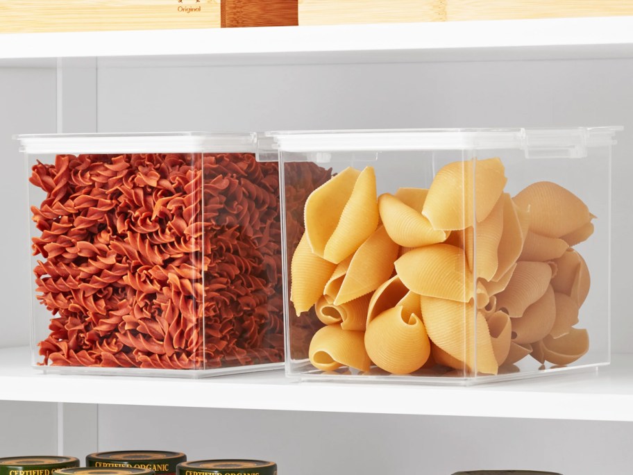 pasta in large containers on pantry shelf