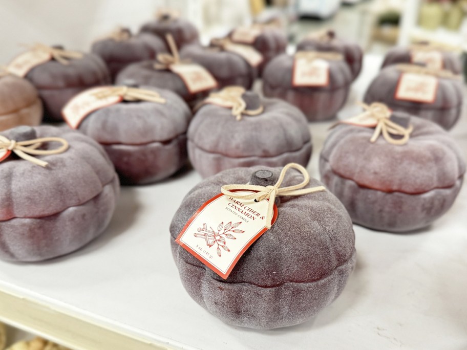 frosted glass pumpkins on store display shelf