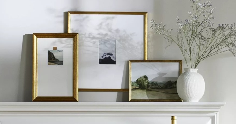 three target wall art frames on mantel