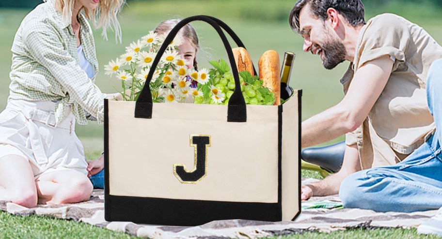 Tote bag displayed next to couple with food and flowers inside