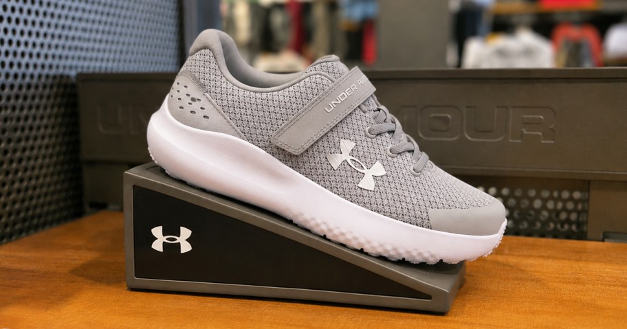 grey under armour running shoe on display in store