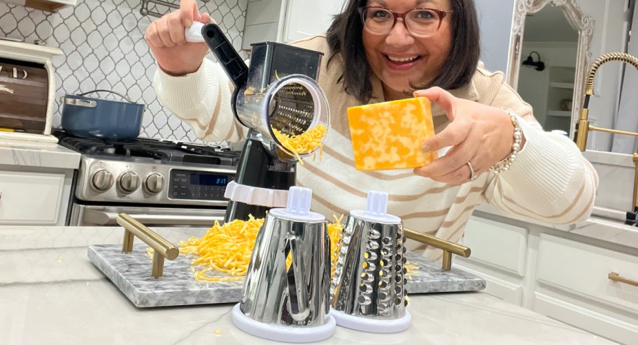 WOman using grater with cheese on a counter