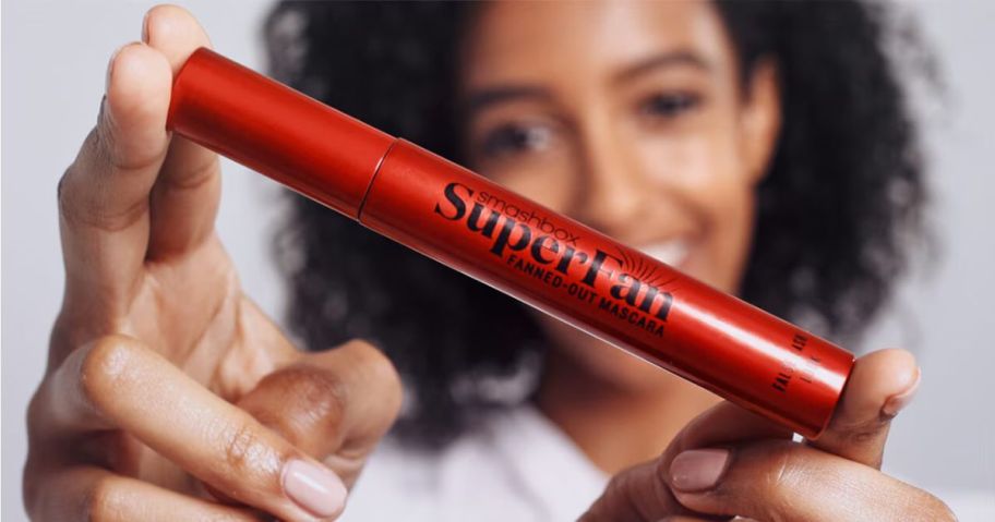 Woman holding a Smashbox SuperFan mascara