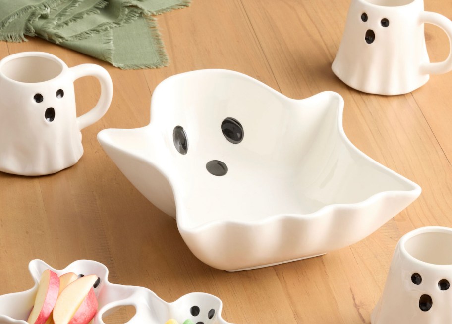 white ghost bowl on wood table with ghost white mugs