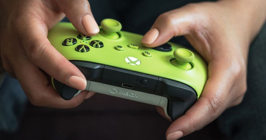 hands holding Xbox Wireless Controller - Electric Volt