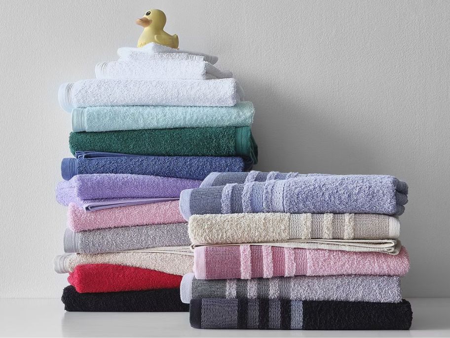 two stack of bath towels in assorted colors