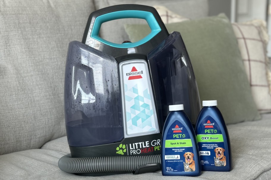 portable cleaner with two bottles of cleaner