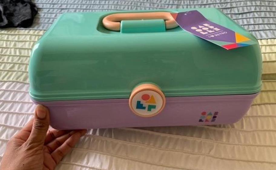 blue and purple caboodle on bed