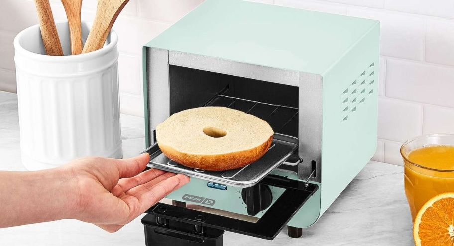 dash mini toaster with bagel displyed on it