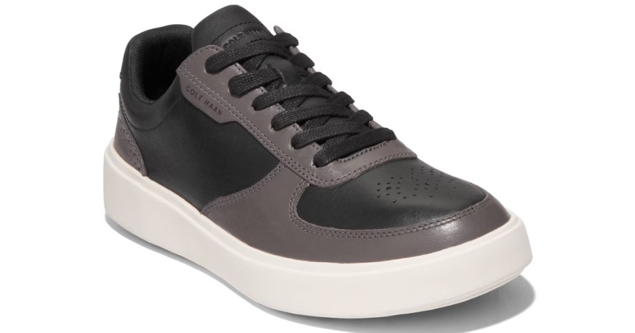 grey and black kid's Vans sneaker