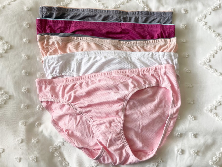 four womens underwear in a stack