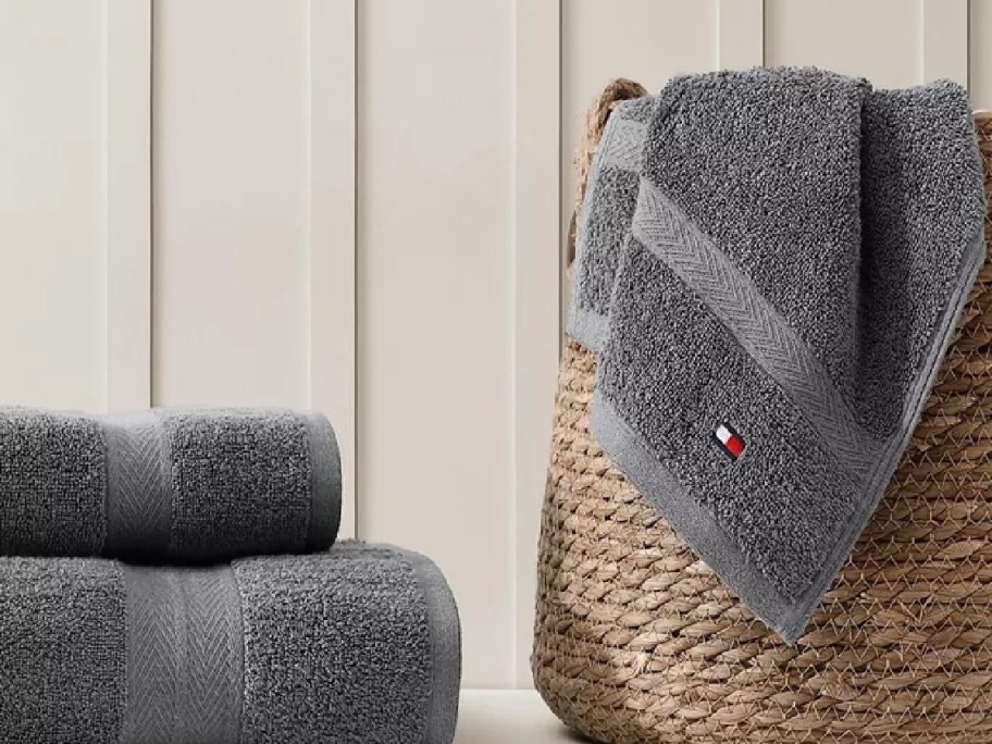 gray bath towels by a laundry basket