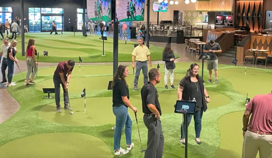 people playing putt putt indoors