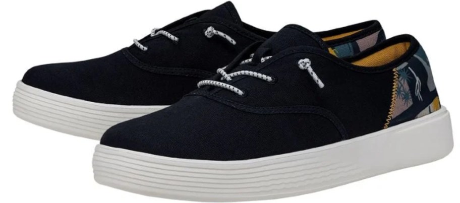 men's HEYDUDE sneakers in black with desert accents on the heel